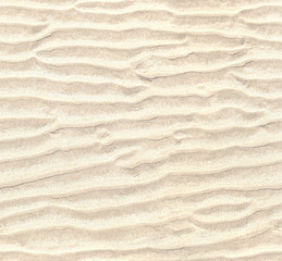 Fototapeta na wymiar Seamless pattern of white sand. Repeating texture of waves on sandy beach background
