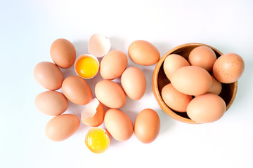 Fresh eggs from the farm placed on a white wooden table background
