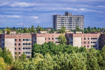 Fototapeta na wymiar Apartment houses in abandoned Prypiat city, located in Chernobyl exclusion area in Ukraine