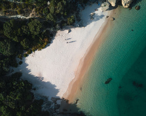 Aerial view of a tropical paradise beach with white sand and clear water in Nature Park Arrabida in Setubal, Portugal.