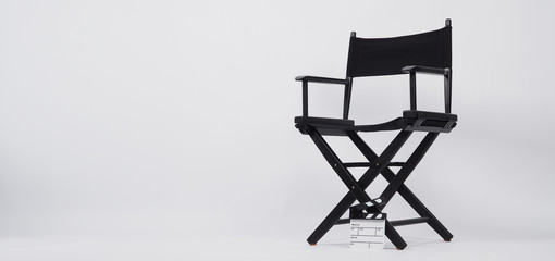 Clapper board or movie slate with director chair use in video production or movie and cinema industry. It's put on white background.