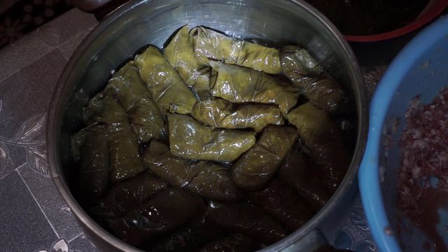Dolma in a stewpot prepared to cook. This Caucasus dish are a grape leaves stuffed with minced meat, mixed with onion, fat and spices.