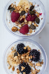 Chia pudding with yogurt, blackberries, raspberries, bananas and oatmeal served in cups