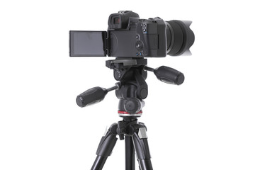 Back view of black camera standing on holder isolated