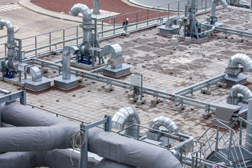 External infrastructure of the microclimate support system at a large industrial site. Air pipelines inlet and exhaust. Fans and air conditioning. Systems of control of pressure, humidity, temperature