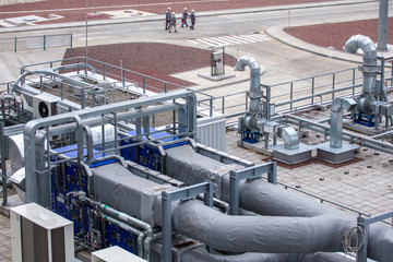 External infrastructure of the microclimate support system at a large industrial site. Air pipelines inlet and exhaust. Fans and air conditioning. Systems of control of pressure, humidity, temperature