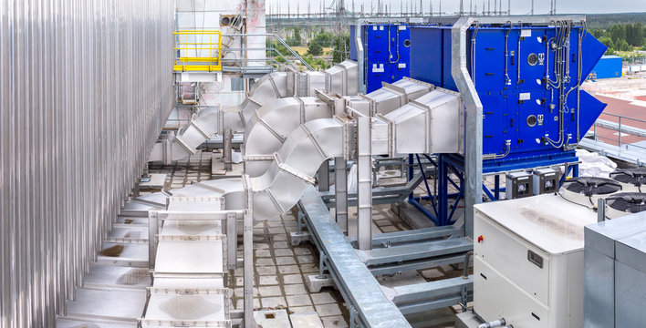 External infrastructure of the microclimate support system at a large industrial site. Air pipelines inlet and exhaust. Fans and air conditioning. Systems of control of pressure, humidity, temperature