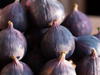 Fresh ripe figs as background, top view. Tropical fruit