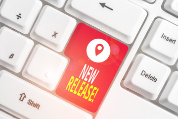 Writing note showing New Release. Business concept for announcing something newsworthy recent...