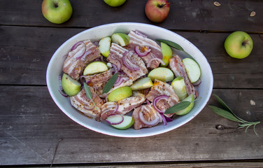 baked pork ribs with onions, apples and sage
