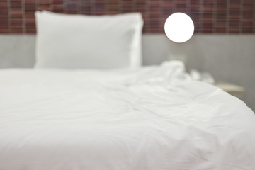 selective focus on soft bed in hotel with beautiful bokeh, shallow depth of field