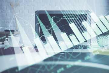 Forex Chart hologram on table with computer background. Double exposure. Concept of financial markets.