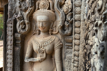 Mural of the woman Apsara on wall Angkor Wat temple complex, close up