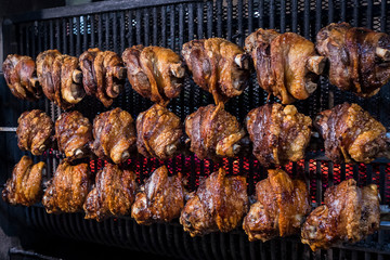 Twenty-one pork leg is grilled in a restaurant. 