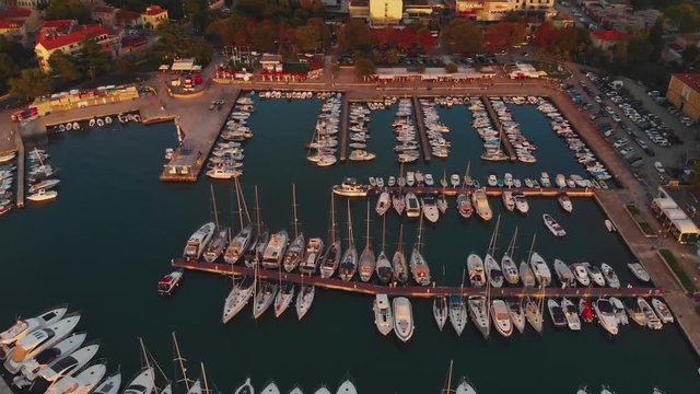 Drone reveal yacht marine, old town, sunrise, golden light 4K