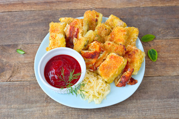 Zucchini- Stücke mit Sosse