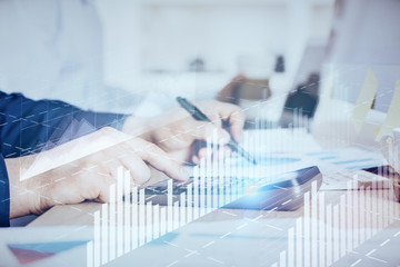 Financial trading graph double exposure with man desktop background.
