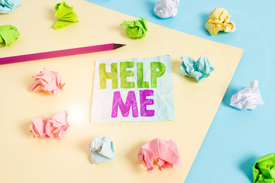 Handwriting text Help Me. Conceptual photo Asking someone to assist you Shouting for it Teamwork Volunteer Colored crumpled papers empty reminder blue yellow background clothespin