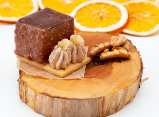 new stylish beautiful chocolate cake on a wooden plate