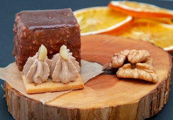 new stylish beautiful chocolate cake on a wooden plate