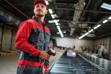 Warehouse worker working on a conveyor line