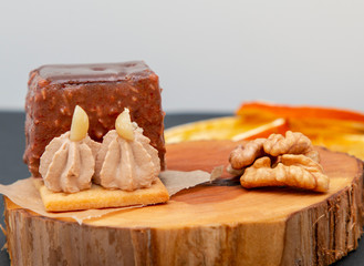 new stylish beautiful chocolate cake on a wooden plate