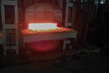 Forging furnace in the process. Industrial equipment with a gas flame. - Powered by Adobe