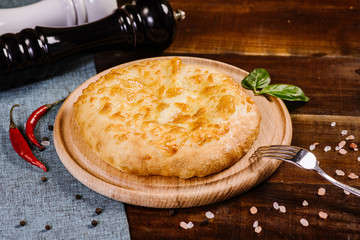 Traditional georgian food khachapuri on the wooden background