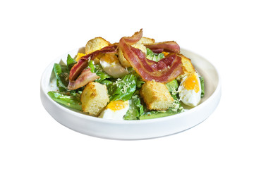 ceasar salad with bacon isolated on white background with clipping path