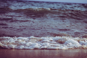 Fototapeta na wymiar Wave of sea on beach in Kallithea, Greece