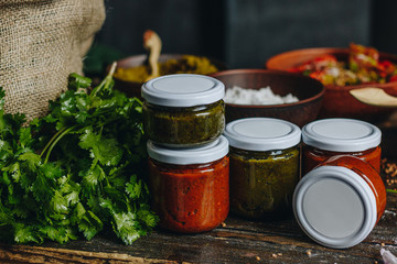 Sauce in a glass jars and ingredients