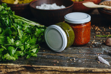 Sauce in a glass jars and ingredients