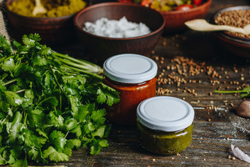 Sauce in a glass jars and ingredients