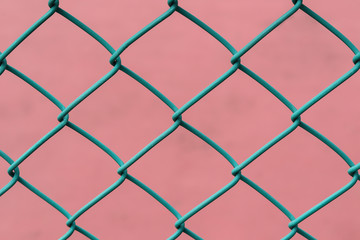 Chain Link Fence with pink Background.