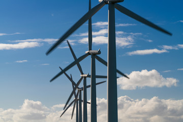 Fototapeta premium Wind turbine energy generaters on wind farm
