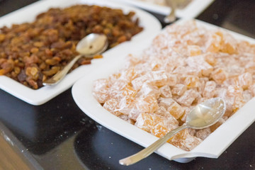 Dish with oriental sweets in a restaurant. Two plates with sweets yusum marmalade rahat lokum.