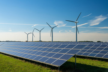 Wind turbine energy generaters on wind farm - Powered by Adobe