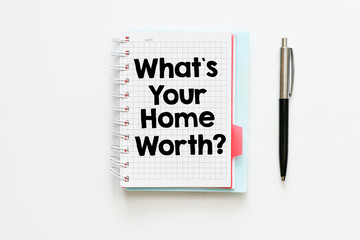 What`s your home worth?  text written in a notebook as a concept