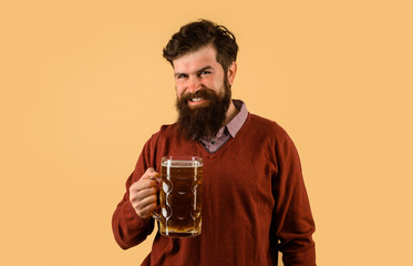 Celebration oktoberfest. Drink, alcohol, leisure and people concept. October fest. Happy man holds mug of beer. Beer pub. Bearded man with glass of beverage. Beer in Germany. Man tasting draft beer.