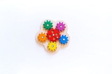 Montessori toy gear . Bright rainbow. White background.