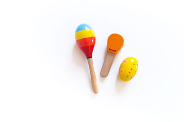 Toys for games with children. Musical instrument made of wood. Bright rainbow.