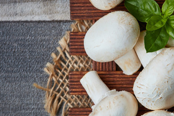 Raw organic champignon mushrooms (Agaricus bisporus). Top view with copy space