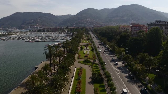 Aerial of park and busy road on Italian coast