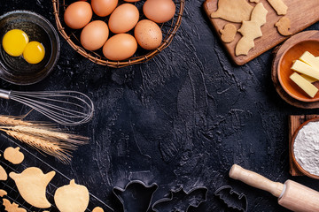 Design concept of making Halloween cookies, baking recipe ingredients layout of preparing party, top view, flat lay, overhead, blank copy space.