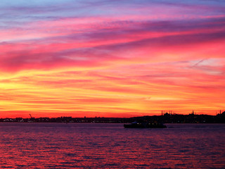 Silhouette of Istanbul. Neon sunset. View of Bosphorus and Istanbul at sunset.