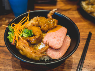 Bowl of hot rice with meat pork and fried crabs