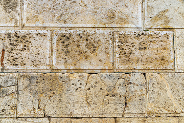 Eroded stone wall as background in Athens, Greece