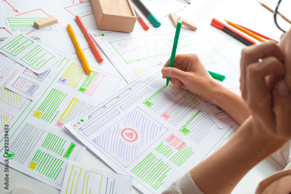 Poster website designer creates a sketch application. developing a project drawing an interface mockup.