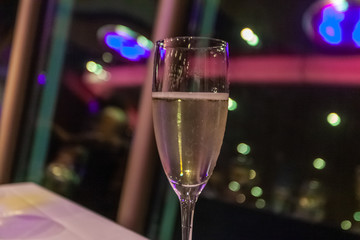 Goblet of white wine with bokeh effect background