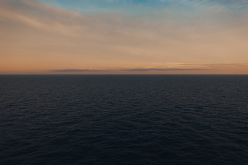 Sky and clouds right after sunset over the sea horizon